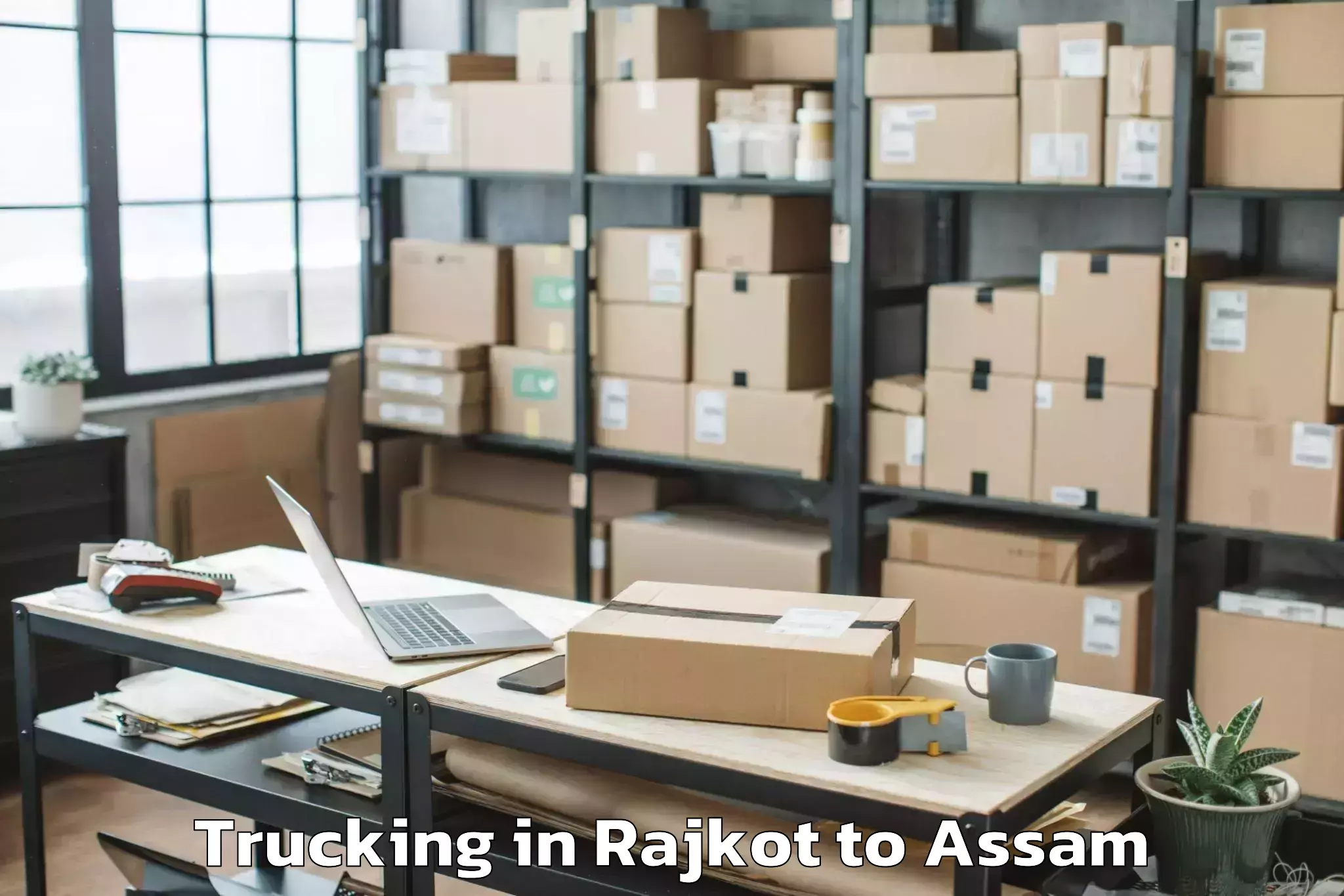 Book Rajkot to Sonai Trucking Online